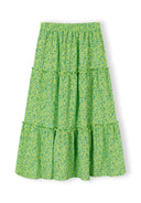 Green floral maxi skirt with elasticated waist and tiered design for girls, featuring a unique and playful style.
