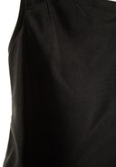 Close-up of black fabric with smooth texture and clean stitching highlighting a stylish asymmetrical design.