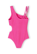 Bright pink asymmetrical girls swimsuit with cut-out waist and double shoulder straps featuring decorative beads.