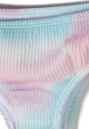 Close-up of textured fabric in pastel pink and blue tie-dye pattern highlighting unique kids swimwear design.