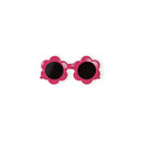 Pink flower-shaped sunglasses with dark lenses for children.