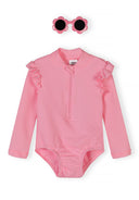 Light pink long sleeve swimsuit with ruffle details and matching flower-shaped sunglasses for kids fashion.