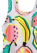 Close-up of colorful sleeveless swimsuit featuring bright fruit patterns with banana and watermelon designs on soft fabric