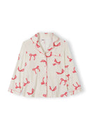 White long sleeve girls’ pyjama top with pink bow print, lapel collar, and button front, designed for comfort and style.