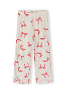 White girls pajama pants with red bow print and elasticated waist featuring a comfortable and stylish design.