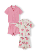 Two girls short sleeve pyjama sets with cream and pink strawberry design and solid pink shorts for kids fashion.