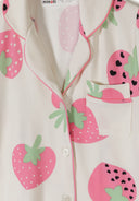 Cream short sleeve pyjama top with pink strawberry design and green leaves, featuring button closure and chest pocket detail