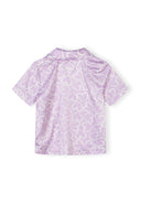 Back view of lilac satin girls' pyjama top with white heart print and short sleeves design