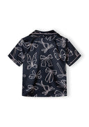 Navy satin girls' top with an all-over delicate bow print design and button front detail