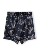 Navy satin shorts featuring a delicate bow print design, ideal for stylish kids and baby fashion.