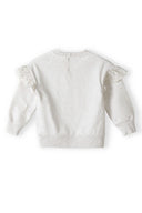 Beige girls sweatshirt featuring delicate frill sleeves and a button closure at the back. Soft fleece fabric for 3m-3y.