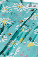 Girls dress frilled sleeves floral green 3m-3y featuring a bright green woven fabric adorned with daisies and buttons.