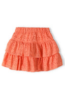 Girls skirt broderie anglaise tiered coral 1-8y made with lightweight coral fabric featuring frilled tiers and intricate embroidery.