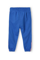 Blue girls jogpant with side taping, soft fleece fabric, elastic waistband and ribbed cuffs, suitable for ages 3-14.