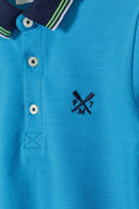 Boys polo shirt with contrast tipping turquoise 1-8y in vibrant turquoise, featuring a classic navy collar and embroidered logo. 
