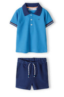 Boys polo shirt and short set contrast details turquoise 3m-3y. Turquoise polo with striped collar, navy shorts with drawcord.