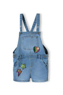 Girls denim short dungaree with neon sequins blue 1-8y featuring multicolor sequined patches, soft mid-blue cotton blend fabric, and adjustable straps.