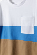 Boys t-shirt cut and sew contrast panels white 3-14y featuring white, blue, and brown panels with a pocket. Soft fabric for comfort.