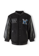 Boys black baseball jacket with faux leather sleeves and glittery blue M patch