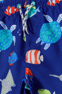 Boys board shorts in blue underwater pattern with adjustable drawcord