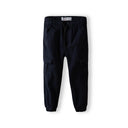 Boys navy combat pants with utility pockets, elasticated waist, and cuffed ankles.