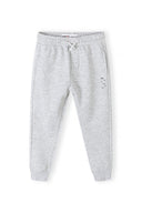 Boys fleece jogpant in gray heathered with drawstring waistband and black text on thigh