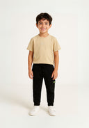 Boys short sleeve t-shirt with joggers set black 3-8y. Tan short sleeve tee paired with black fleece joggers, ideal for comfort.
