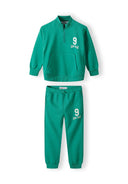 Boys sweatshirt and joggers set half zip green 1-8y, featuring a kangaroo pocket and elasticated waistband. Soft, relaxed fit.
