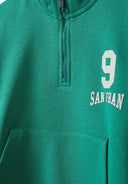 Green boys sweatshirt with half zip, stand-up collar, kangaroo pocket, and printed detail. Perfect for ages 1-8 years.