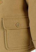 Boys tan wool duffle coat pocket with toggle fastening button