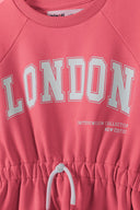 Girls fleece dress in coral pink with London graphic on chest