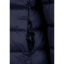 Close-up of a navy girls quilted jacket with a subtle pocket and light padding.