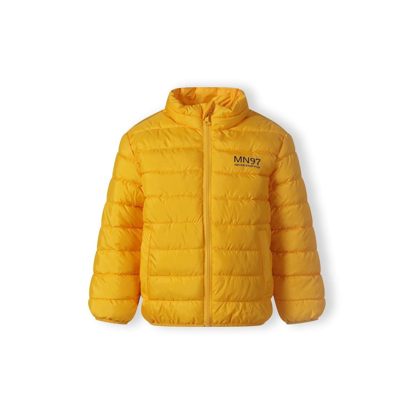 Close-up detail of yellow jacket showing zip closure, Minoti brand label, and quilted padding texture