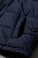 Dark navy menâ€™s winter jacket with fur hood and zipper closure